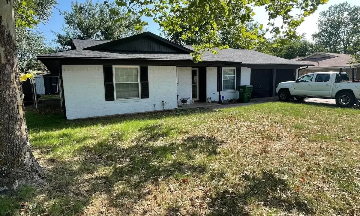 Professional roofing crew working on a residential roof in Draper